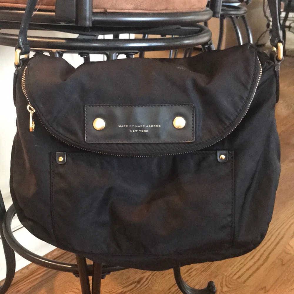 MARC JACOBS NY black bag with gold hardware.